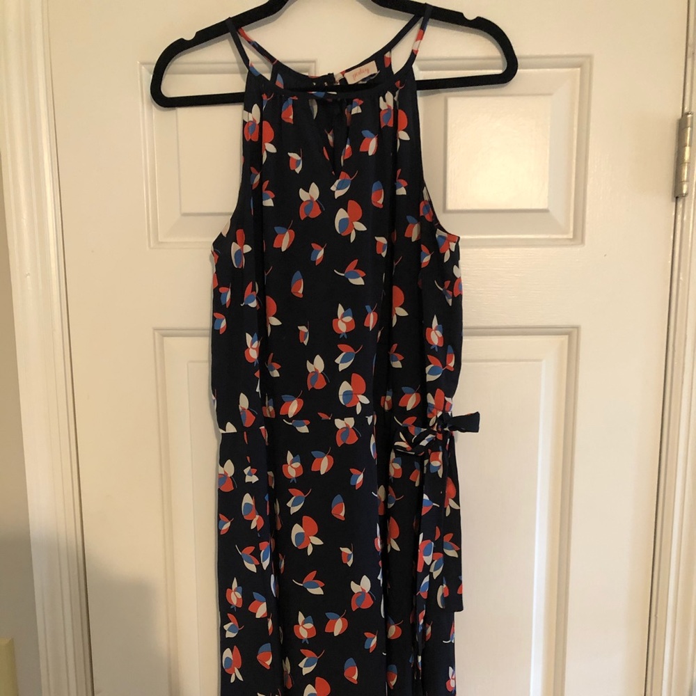 High neck sleeveless dress with floral print.